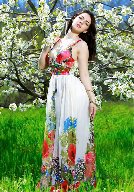 Very attractive dark-haired young Sivilla in fancy skirt bares tiny tits and hairy pussy outside